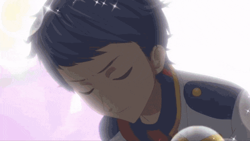 a close up of a boy 's face with his eyes closed