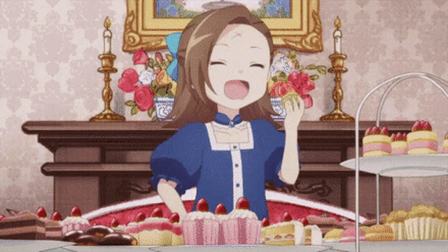 a girl in a blue dress stands in front of a table full of desserts