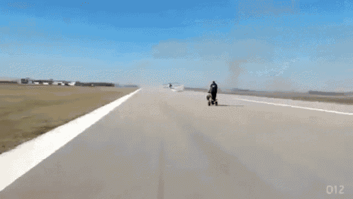a plane is crashing on a runway with the number 012 on the bottom