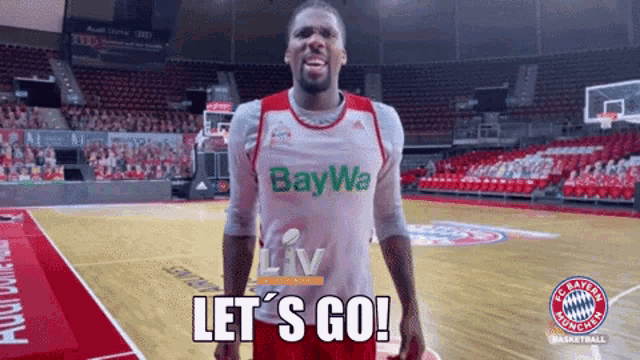 a basketball player says let 's go in front of an empty stadium