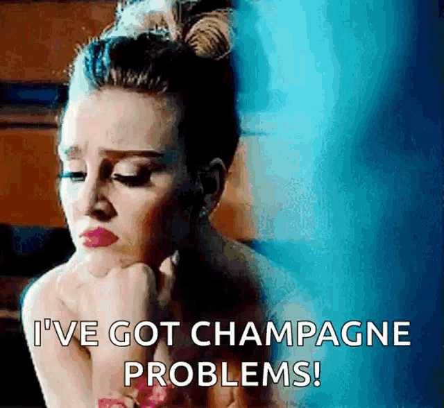 a woman with a bun on her head is saying i 've got champagne problems