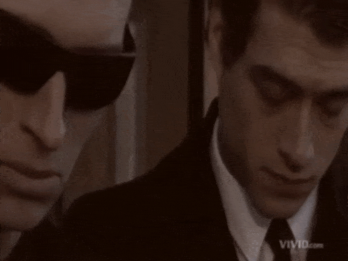 two men are standing next to each other and the word shotgun is on the screen