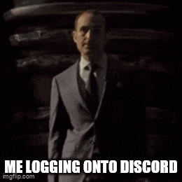 a picture of a man in a suit and tie behind a sandwich with the caption me logging onto discord