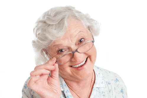 an older woman wearing glasses is smiling and looking over her glasses