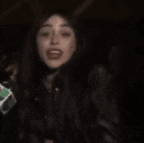 a blurry picture of a woman screaming with her mouth wide open