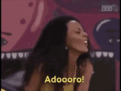 a woman is smiling and saying adooro .