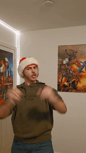 a man wearing a santa hat and an african eagle sweatshirt