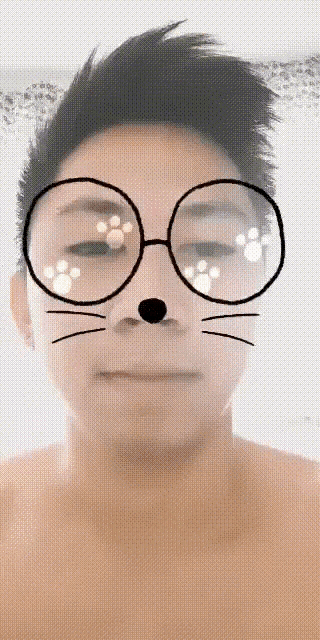 a man wearing glasses and a cat nose