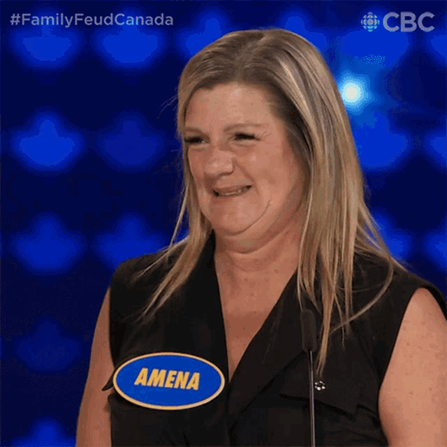 a woman with a name tag that says amena