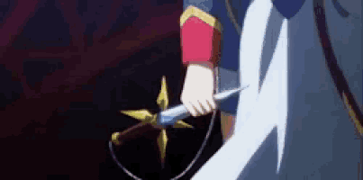 a person is holding a sword with a star on it in a dark room .