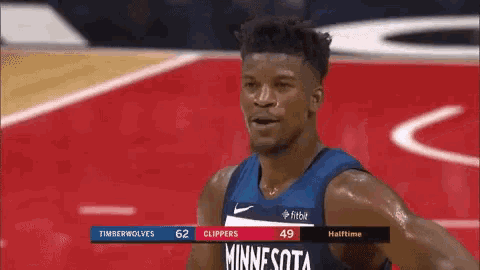 a basketball player for the minnesota timberwolves is on the court during a game .
