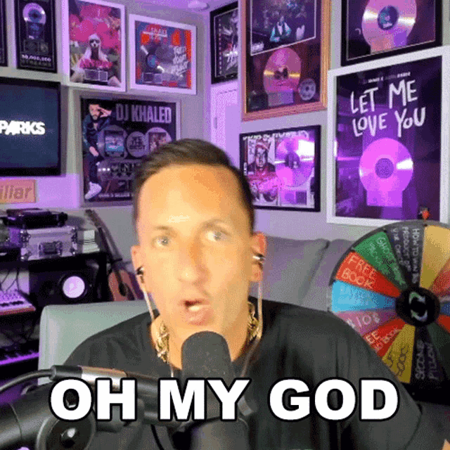 a man speaking into a microphone with the words oh my god written on his face