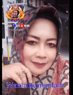 a woman wearing a scarf and a ring is smiling with the words waalaikumsalam below her