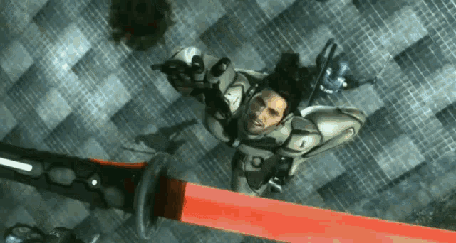 a man in a futuristic suit is holding a red light sword
