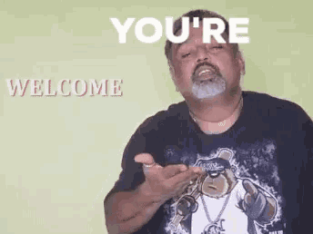 a man with a beard is wearing a black shirt with a picture of a bear on it .