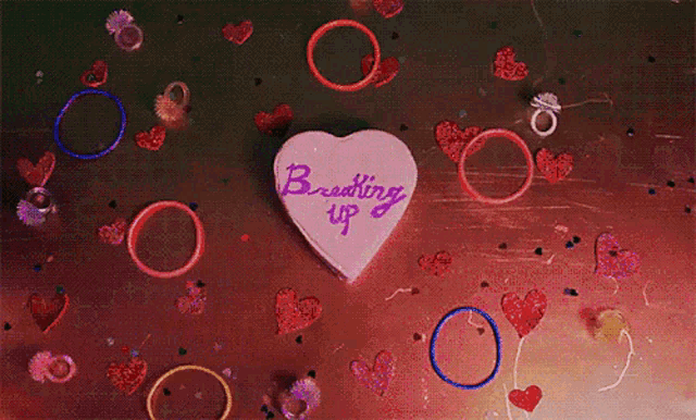 a person is holding a pink brush over a piece of paper that says ' king ' on it