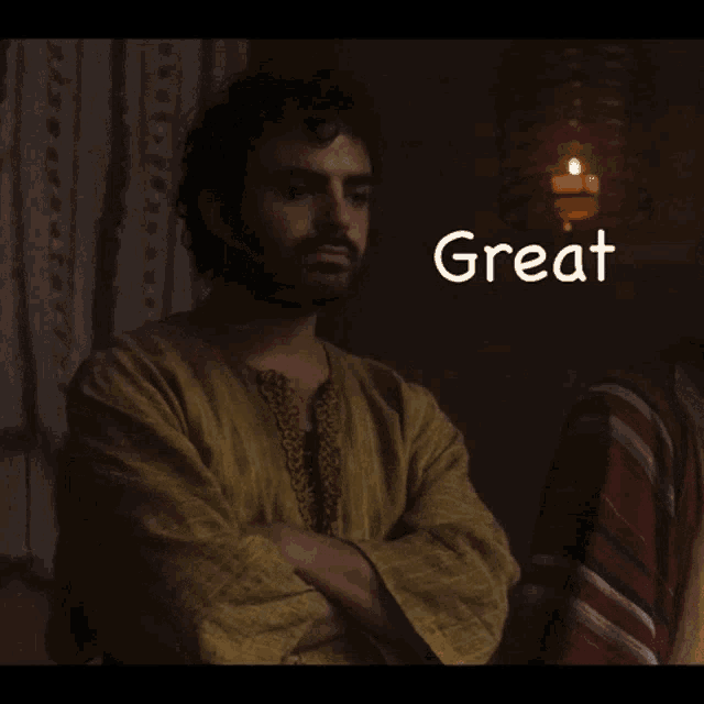 a man with his arms crossed has the word great written above him