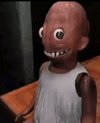 a close up of a doll with a big eye .