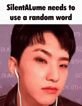 a man wearing earphones is making a funny face while looking at the camera .