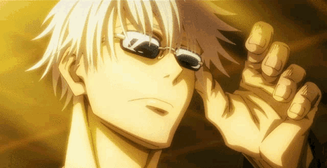 a close up of a person wearing sunglasses with a gold background