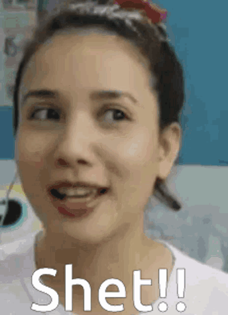 a close up of a woman 's face with the word shet on it