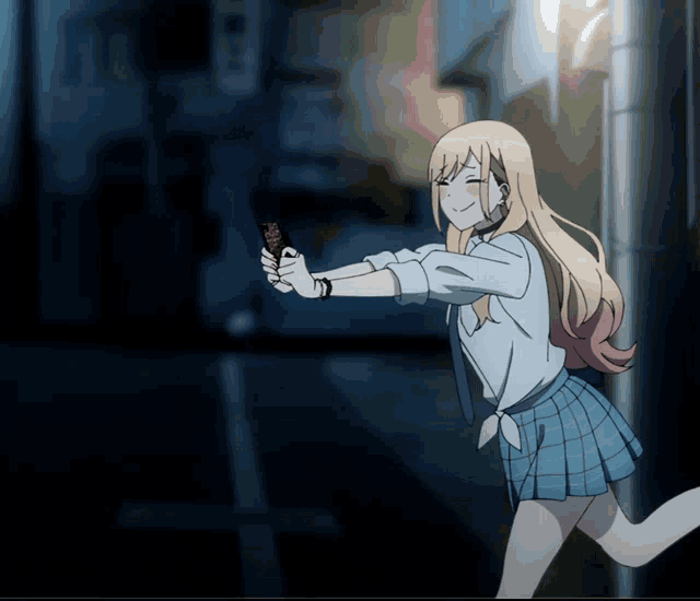 a girl in a blue plaid skirt is holding a cell phone in her hand