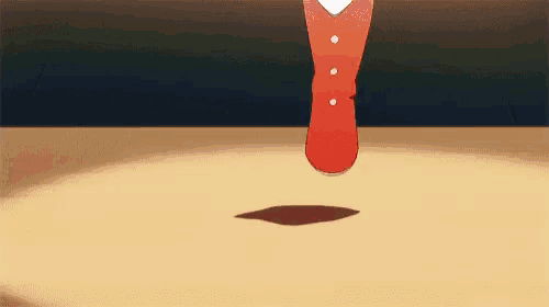 a cartoon character is standing on a table with a red shoe on .