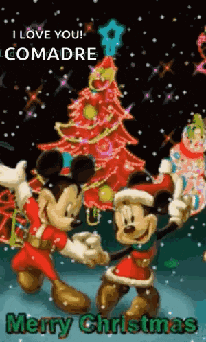 mickey mouse and minnie mouse are dancing in front of a christmas tree