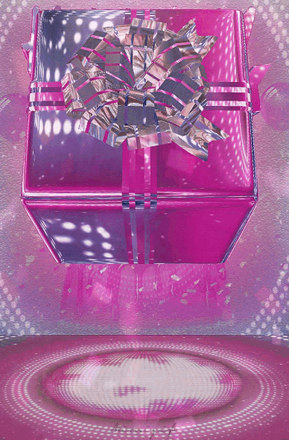a pink gift box with a silver bow on it
