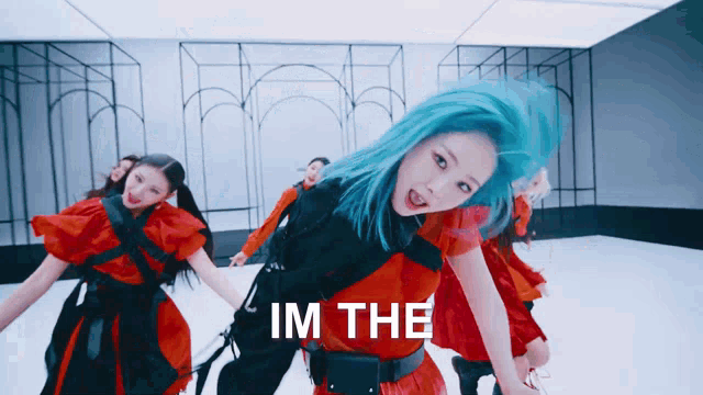 a girl with blue hair is dancing with the words im the behind her