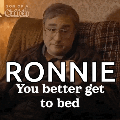 a man is sitting in a chair with the words " ronnie you better get to bed " above him