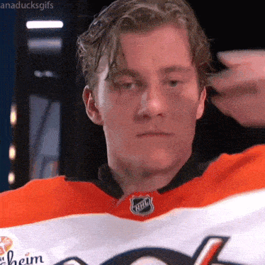 a close up of a hockey player wearing an nhl jersey .