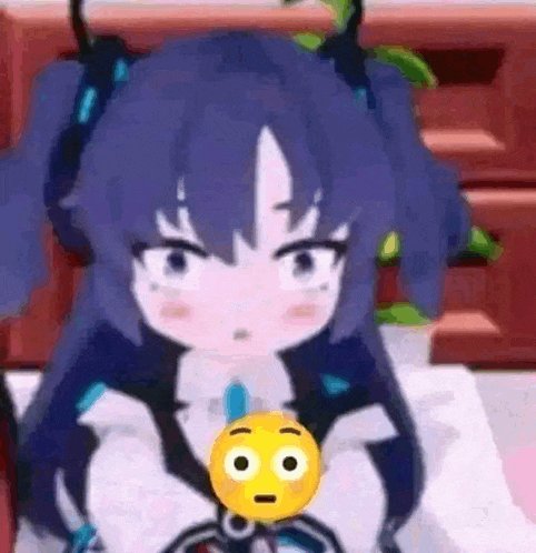 a girl is holding a yellow smiley face in her hand .