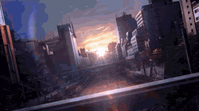 a cityscape with a sunset in the background