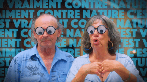 a man and a woman wearing glasses with googly eyes