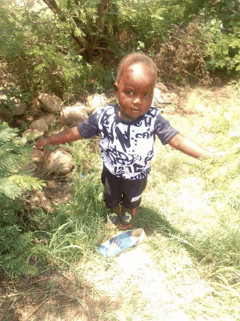 a child wearing a shirt that says ' n.c.a. ' on it