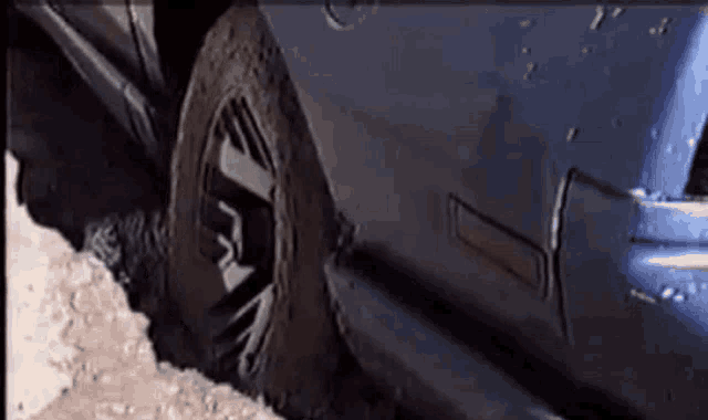 a close up of a car 's tire with the number 3 on it