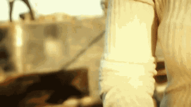 a close up of a person 's arm with a blurry background .