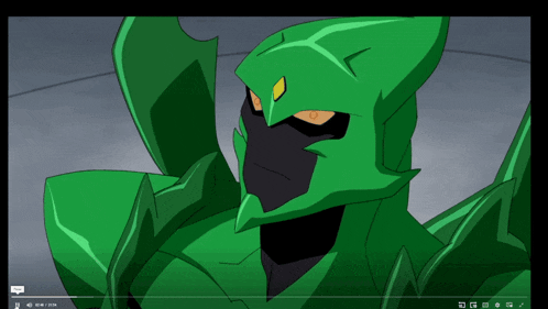 a video of a green cartoon character is playing on a computer screen