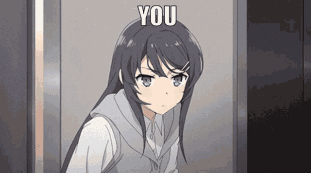 a girl with long black hair is standing in front of a door with the words you above her head