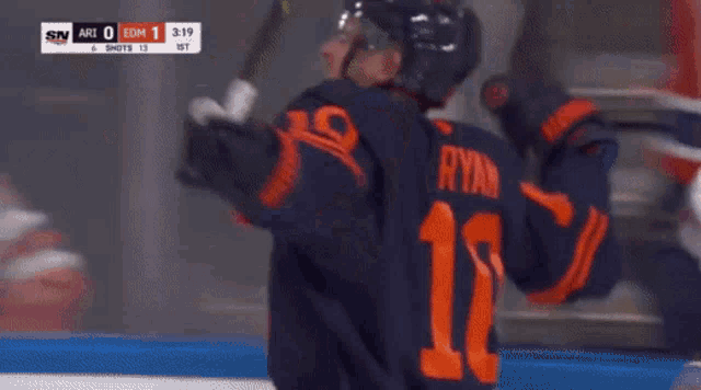 a hockey player wearing a jersey that says ' kostin ' on it