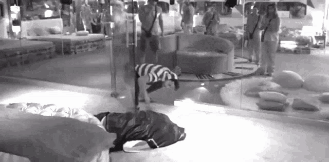 a black and white photo of a person doing a handstand