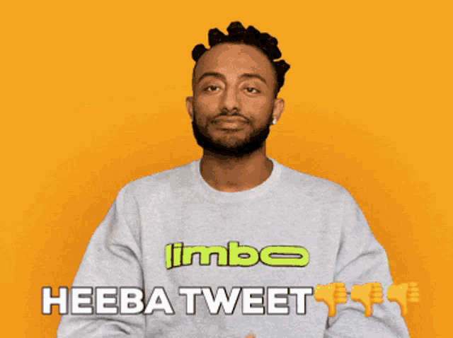 a man wearing a limbo shirt is giving a thumbs down
