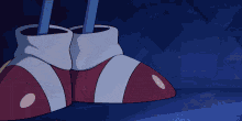 a pair of red and white striped shoes on a blue background