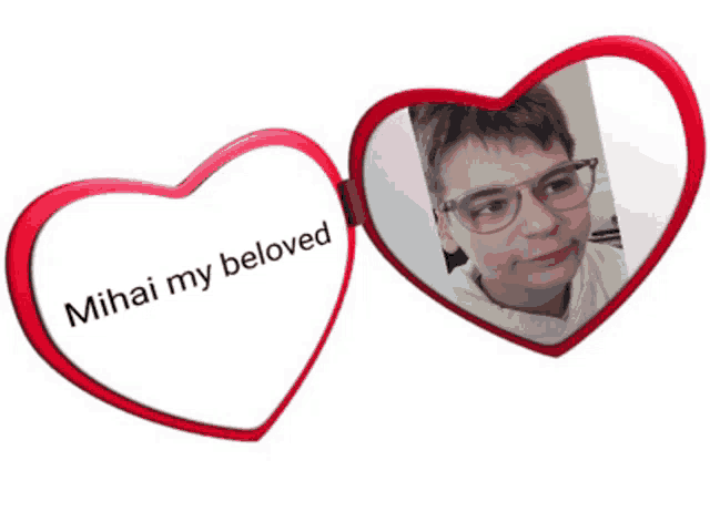 a heart shaped mirror says mihai my beloved on it