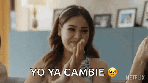 a woman is clapping her hands and says yo ya cambie