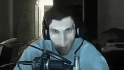 a man is wearing headphones and a microphone