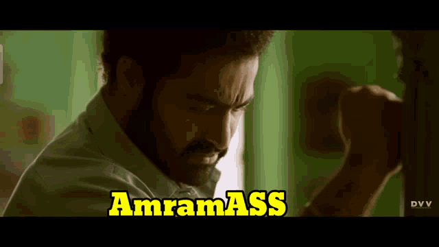 a close up of a man 's face with the words amram ass written in yellow