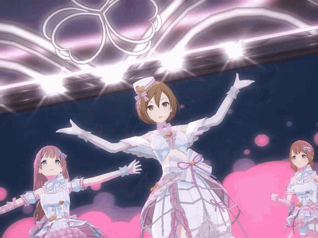 a girl in a white dress is standing on a stage