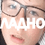a close up of a person wearing glasses with the word naaho written in white letters .